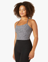Load image into Gallery viewer, Woman wearing grey tank top and black yoga leggings from Beyond yoga.