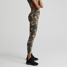 Load image into Gallery viewer, Female model wearing flaxen tie dye colored Let's Go High Rise leggings from Varley