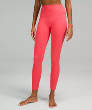 Load image into Gallery viewer, female model wearing pale raspberry colored leggings from lululemon