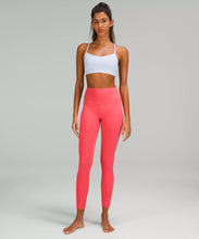 Load image into Gallery viewer, female model wearing pale raspberry colored leggings from lululemon