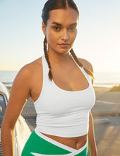 Load image into Gallery viewer, Woman wearing white beyond yoga halter top and green and white leggings.
