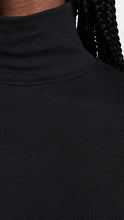 Load image into Gallery viewer, Female model wearing essential ribbed turtleneck from beyond yoga
