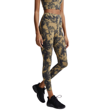 Load image into Gallery viewer, Female model wearing flaxen tie dye colored Let's Go High Rise leggings from Varley