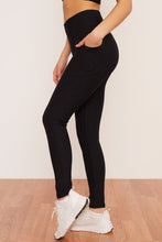 Load image into Gallery viewer, Female model wearing black pocket legging from wolven
