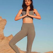 Load image into Gallery viewer, Female model wearing gray pocket legging from wolven