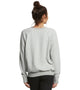 Woman wearing a grey sweater from Spiritual Gangster.