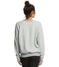 Load image into Gallery viewer, Woman wearing a grey sweater from Spiritual Gangster.