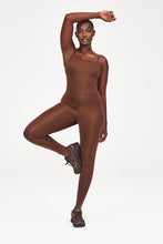 Load image into Gallery viewer, Woman wearing Brown Unitard from Girlfriend Collective