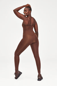 Woman wearing Brown Unitard from Girlfriend Collective