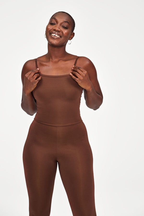 Woman wearing Brown Unitard from Girlfriend Collective