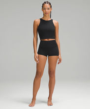 Load image into Gallery viewer, Woman wearing a black sports bra and black shorts