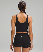 Load image into Gallery viewer, Back of a woman wearing a black sports bra and black shorts from lululemon