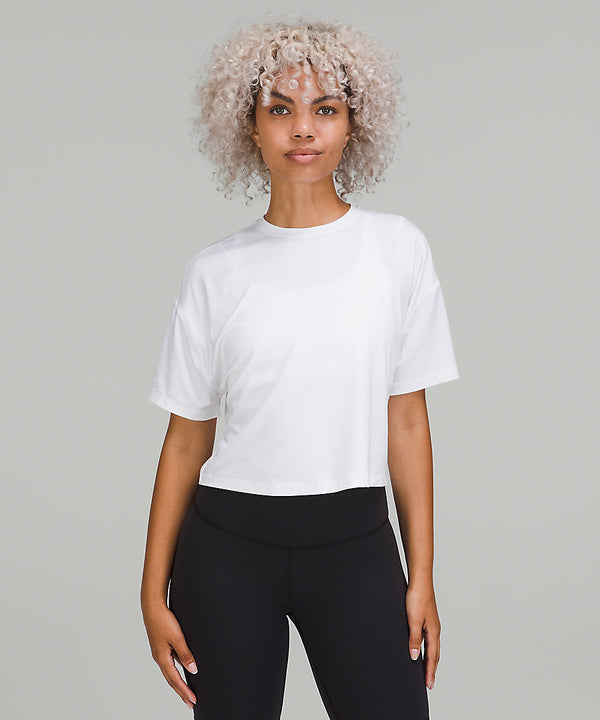 Woman wearing white t-shirt and black pants from lululemon