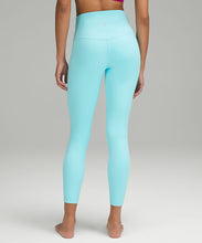 Load image into Gallery viewer, Back oBack view of a woman wearing lululemon yoga leggings in cyan blue