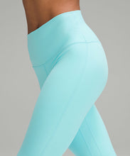 Load image into Gallery viewer, Close up of a woman wearing lululemon yoga leggings in cyan blue