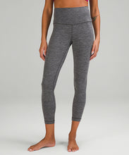 Load image into Gallery viewer, Legs of a woman wearing grey yoga leggings from lululemon