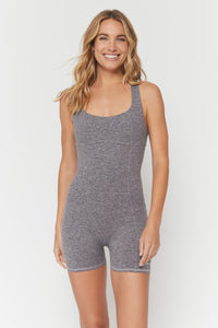 woman wearing a grey spiritual gangster bodysuit