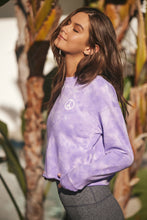 Load image into Gallery viewer, woman wearing a purple and white tie dye sweatshirt with grey bottoms