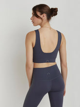 Load image into Gallery viewer, Model wearing deepest slate sports bra tank with scoop back 
