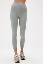 Load image into Gallery viewer, woman in stormy blue yoga leggings with grey sneakers