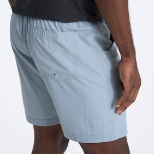 male model wearing light blue athletic shorts