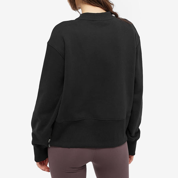 Female model wearing black Eton Sweater from Varley