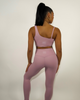 Female model wearing light pink leggings from kosha fit