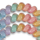 Close up of three rainbow hair ties