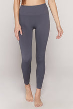 Load image into Gallery viewer, Female model wearing slate gray leggings from spiritual gangster
