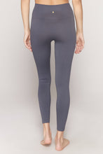 Load image into Gallery viewer, Female model wearing slate gray leggings from spiritual gangster