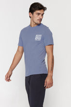 Load image into Gallery viewer, male model wearing &quot;meditate, manifest, repeat&quot; washed blue t-shirt from spiritual gangster 