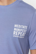 Load image into Gallery viewer, male model wearing &quot;meditate, manifest, repeat&quot; washed blue t-shirt from spiritual gangster 