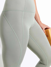 Load image into Gallery viewer, Female model wearing agave colored leggings from Girlfriend Collective