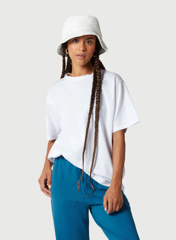 Female model wearing white t-shirt from Nux activewear