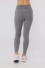 Load image into Gallery viewer, Female model wearing gray leggings with pink running shoes