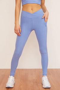 Female model wearing light blue leggings from Wolven