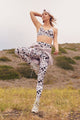 Female model wearing pink leopard print leggings from spiritual gangster