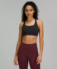 Load image into Gallery viewer, Female model wearing black sports bra and maroon leggings