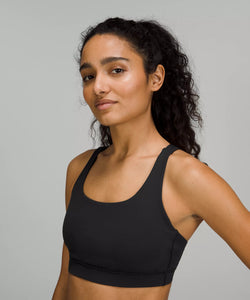 Female model wearing black sports bra