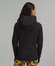 Load image into Gallery viewer, Female model wearing black full zip hoodie
