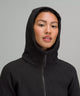 Female model wearing black full zip hoodie