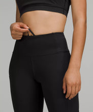 Load image into Gallery viewer, Female model wearing black leggings  from lululemon