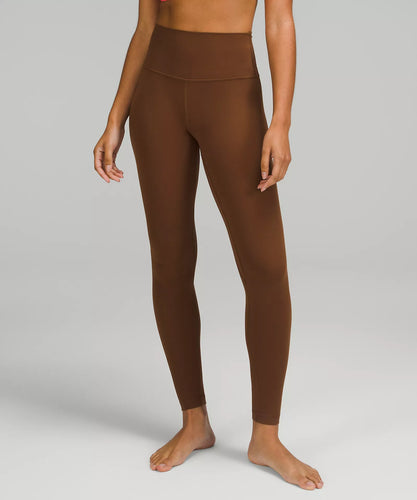 Female model wearing brown leggings