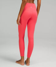 Load image into Gallery viewer, female model wearing pale raspberry colored leggings from lululemon