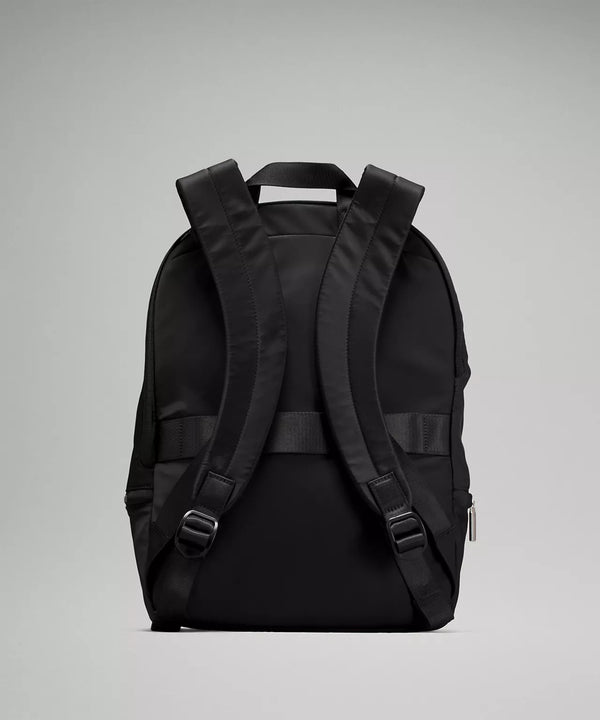 Backside of black backpack