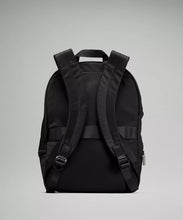 Load image into Gallery viewer, Backside of black backpack