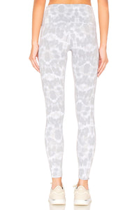 Female model wearing nocturnal leopard print gray leggings from Onzie