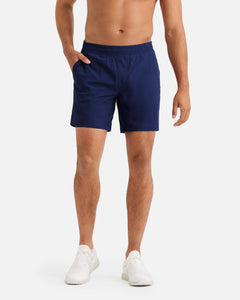 male model wearing navy blue athletic shorts 