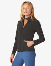 Load image into Gallery viewer, Female model wearing darkest night colored on the go mock neck jacket from beyond yoga