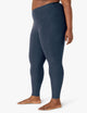 female model wearing beyond yoga leggings in nocturnal navy color